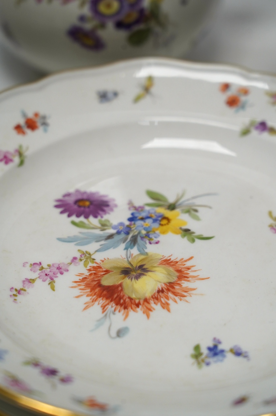 An early 20th century Meissen porcelain teaset, painted with insect and floral decoration, tallest 20cm. Condition - fair to good